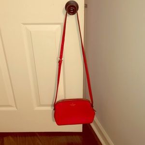 Red Kate Spade crossbody bag.